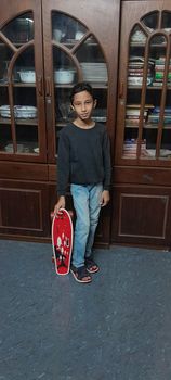 Areeb with smaller skateboard
